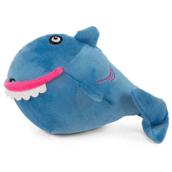 Side profile picture of the godog action plush shark. a soft blue plush with a goofy plump body and a rounded row of friendly teeth.